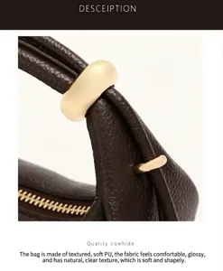 Detailed view of women casual shoulder bag handle with elegant metal ring and smooth zipper.