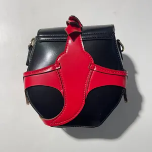 Creative color-blocking shoulder crossbody bag with unique bat design, stylish and chic.
