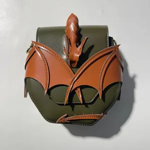 Dark green crossbody bag with 3D brown leather dragon wings detail for unique Halloween style.