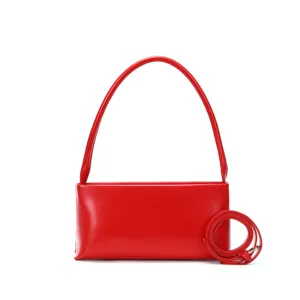 Red minimalist baguette underarm bag with single handle and crossbody strap stylish everyday.