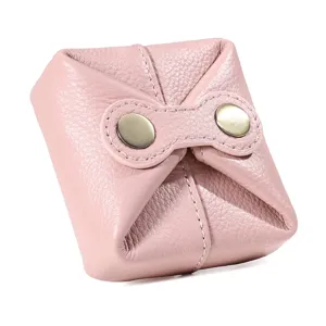 Cute pink cowhide leather coin purse, mini portable lipstick and headphone storage bag.