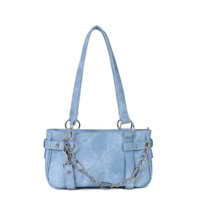Stylish light blue shoulder bag with metal chain design, trendy underarm bag for women.