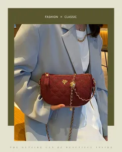 Detail view of the quilted caviar leather chain shoulder bag in wine red, elegant gold accents.