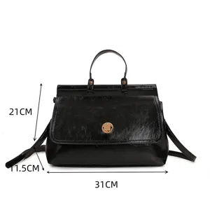 Classic black retro handbag for women, spacious top handle tote with elegant metal lock design.