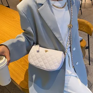 Elegant quilted shoulder bag for women, luxury style chain crossbody bag with ball.