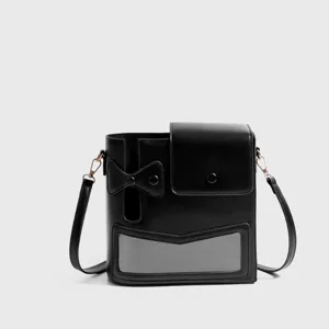Black crossbody shoulder bag with unique flap pocket bow design and rose gold hardware stylish.