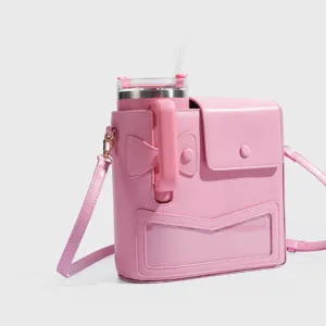Pink tumbler crossbody bag with strap, clear pocket, and cute bow design for outdoor travel.