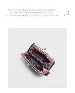 Vintage genuine leather kiss-lock coin purse interior detail view with polka dot lining compartments.