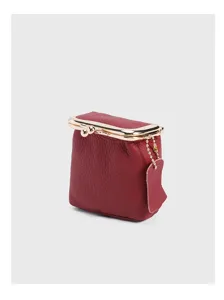 Compact genuine leather kiss lock coin purse detail view, elegant mini lipstick storage bag.