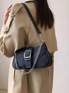 Stylish dark denim shoulder bag with silver chain and chic buckle for women's daily wear.