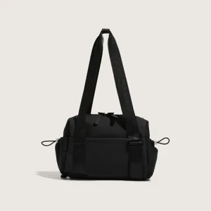Close-up view of the black nylon gym shoulder bag featuring durable straps and zippers.