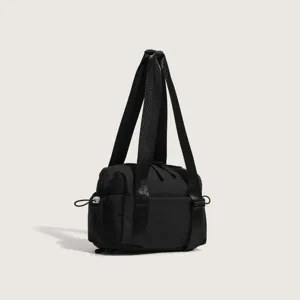 Black nylon sports shoulder bag detail showing sturdy straps and durable fabric construction.
