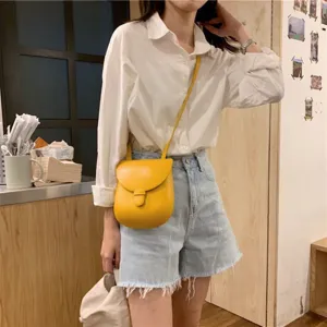 Minimalistische gelbe Vintage-Satteltasche, stilvolle Umhängetasche für den täglichen Gebrauch.