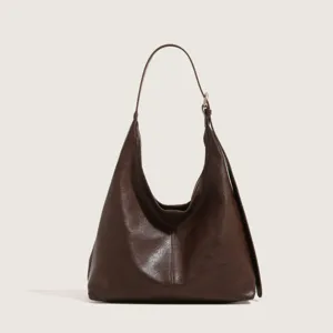 Dark brown leather hobo shoulder bag detail, vintage minimalist daily commute tote handbag.
