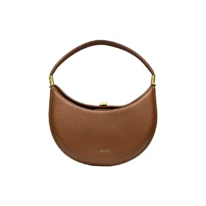 Brown crescent underarm bag detail, premium leather texture, elegant hobo design showcase