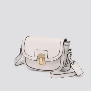 Chic white women saddle bag with black piping and gold metal lock. Stylish vintage crossbody bag.
