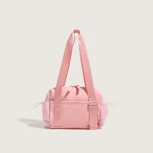 Pink nylon shoulder bag for women, multi-functional travel gym bag with long comfortable straps.