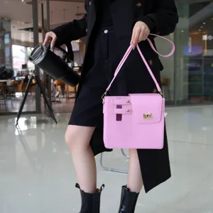 Pink outdoor portable cup shoulder bag, stylish crossbody storage bag for daily commute.