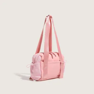 Pink nylon fitness tote bag detail view, multi-functional travel shoulder bag with spacious capacity.