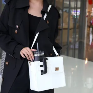 Crossbody cup bag with tumbler holder, white leather outdoor portable water bottle storage.
