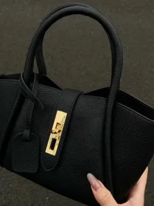 Black pebbled leather handbag with chic metal lock closure, top handle tote bag for women daily work.