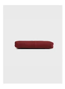 Red leather pouch detail view, showing fine stitching and compact soft texture design.