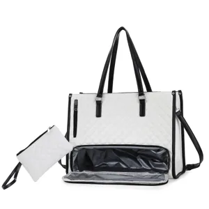 Detailed view of the large white quilted tote bag with black trim and bottom lunch compartment.