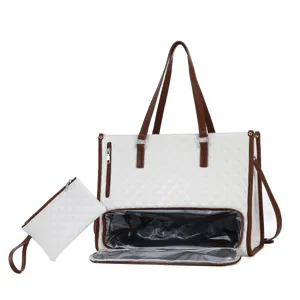 White quilted tote bag detail showing lunch compartment and matching small pouch.