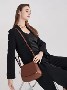 Vintage brown saddle bag for women, chic minimalist crossbody shoulder bag with flap.