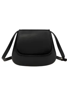Classic black leather vintage saddle bag for women, chic minimalist crossbody shoulder bag.
