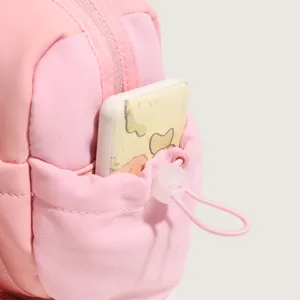 Pink nylon sports fitness bag detail shot, showing convenient front drawstring pocket and toggle.