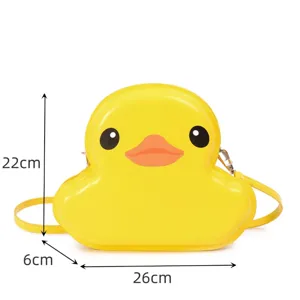 Detailed view of the cute yellow duck shaped hard shell crossbody bag with clear dimension guides.