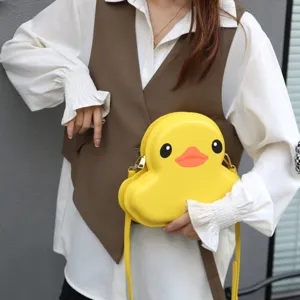 Close-up detail of the cute yellow duck hard shell crossbody bag, stylish and playful.