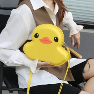 Yellow duck shaped cute hard shell crossbody bag detail view, fashion cartoon shoulder bag.