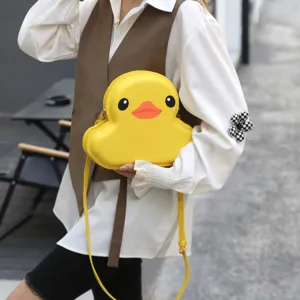 Cute yellow duck shaped hard shell crossbody bag for women, stylish cartoon shoulder handbag.