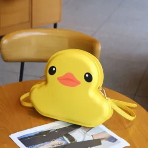 Yellow duck shaped hard shell crossbody bag, cute cartoon style fashion purse for daily wear.
