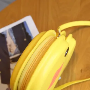 Detailed view of cute yellow duck shaped shell crossbody bag for women cartoon daily style