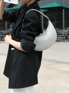 Chic pebbled leather crescent shoulder bag for women, stylish underarm hobo handbag daily commute.