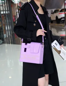 Purple crocodile pattern crossbody cup bag, stylish outdoor portable shoulder storage bag.