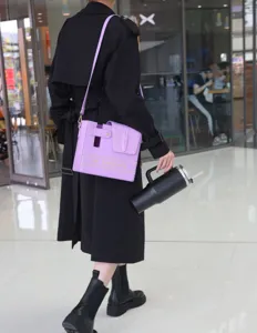 Light purple crocodile pattern shoulder water cup bag, detail view showing strap and tumbler.