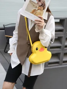 Cute yellow duck shaped hard shell crossbody bag for women, stylish and fun fashion accessory.