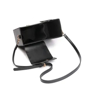 Black structured crossbody water bottle bag with internal dividers and adjustable strap.