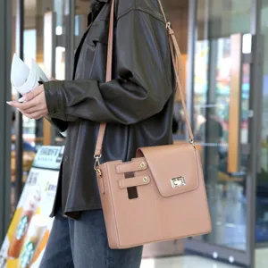 Outdoor portable water bottle bag shoulder crossbody bag detail view in stylish brown leather.