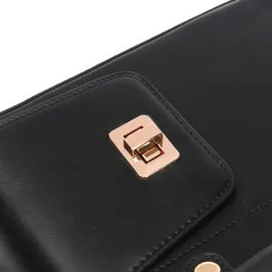 Detail view of black leather water bottle pouch featuring a secure gold metal lock closure.