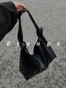 Black PU leather knotted shoulder bag for women, stylish hobo tote casual handbag.