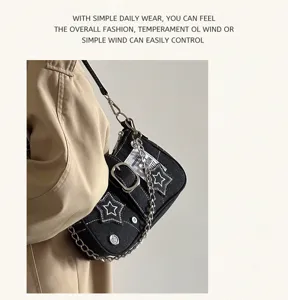 Retro star denim underarm shoulder bag for women, stylish street style fashion chain handbag.