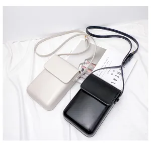 Minimalist mini vertical crossbody phone bag for women and men, chic leather shoulder pouch.