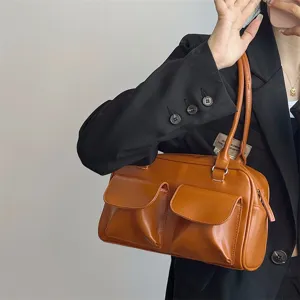 Stylish brown vintage shoulder bag for women with dual front pockets and zipper closure