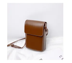 Vintage brown vertical mini crossbody phone bag, minimalist leather pouch for daily use.