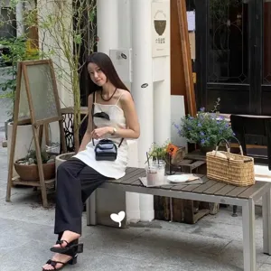 Stylish black patent leather shoulder bag for women, retro small crossbody shell handbag.